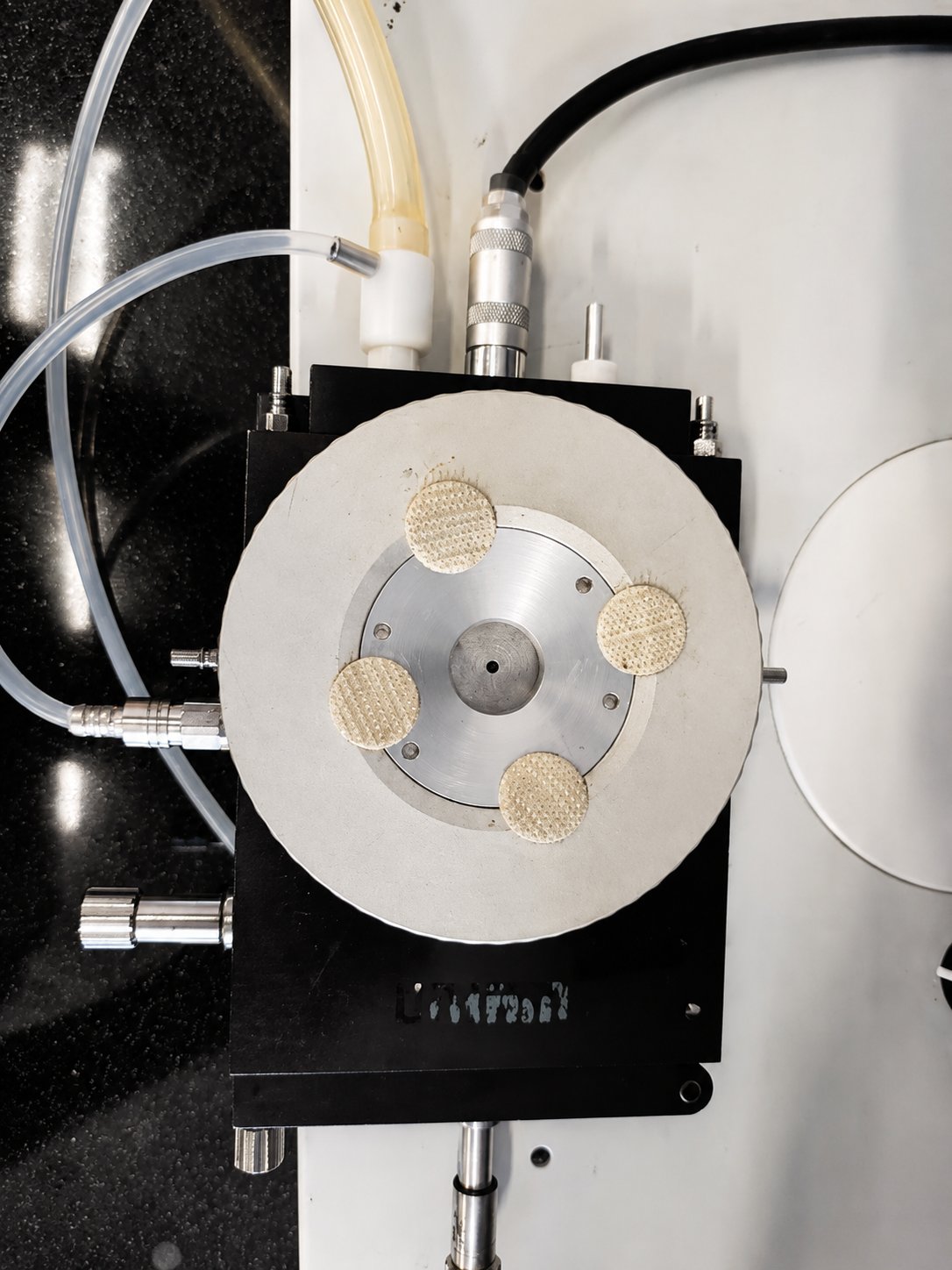 The Linkam cold stage with mounted samples and liquid-nitrogen lines